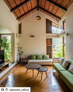 a living room filled with furniture and a flat screen tv