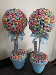 two blue vases with candy in them