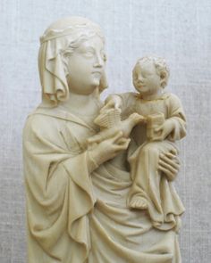 a statue of a woman holding a child