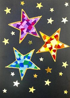 three brightly colored stars on a black background