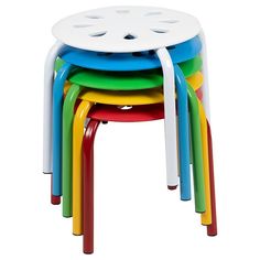 multicolored plastic stools stacked on top of each other