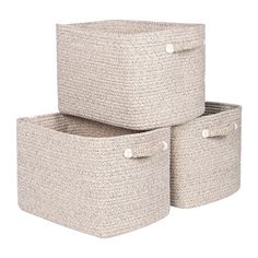 three storage baskets with handles on each side and buttons at the top, one in beige