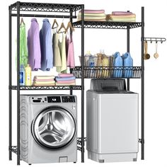 a washer and dryer sitting next to each other in front of a drying rack