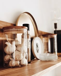 some garlic cloves and other items on a shelf