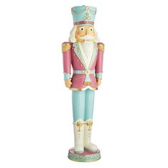 a nutcracker figurine is shown in pink and blue with gold trim