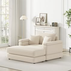 a living room with white walls and furniture