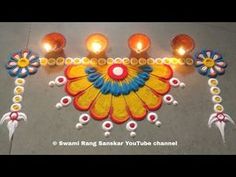 an image of a decorated diya with candles