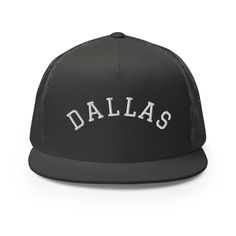 a black and white hat with the word dallas on it