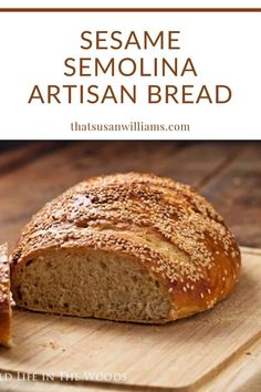 sesame artisan bread on a cutting board with text overlay that reads sesame artisan bread