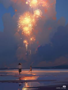 two people standing on the beach watching fireworks