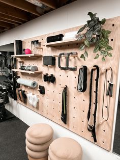 there are many different items on the wall in this room, including stools and shelves