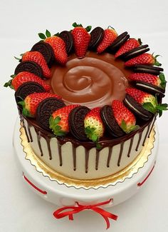 a chocolate covered cake with strawberries on top