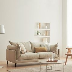 a living room filled with furniture and white walls