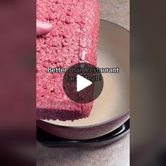 a person is holding up a piece of raw ground beef on a plate with the words, better than restaurant tacobath