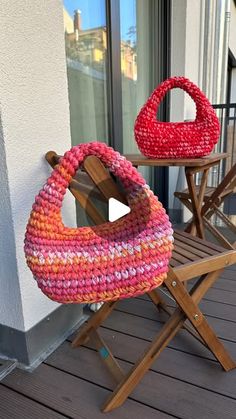 two chairs sitting on top of a wooden deck