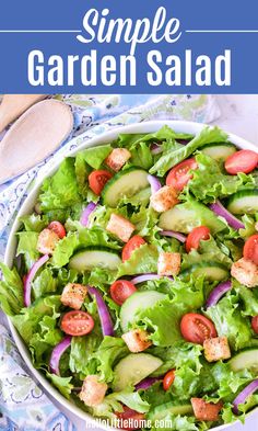 a salad with lettuce, tomatoes and cucumbers in it is shown