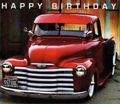 an old red truck with the words happy birthday on it