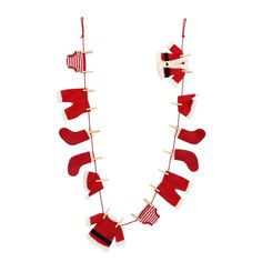 a red and white christmas stocking garland with stockings hanging from it's sides