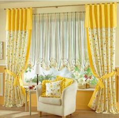 a living room filled with furniture and yellow curtains