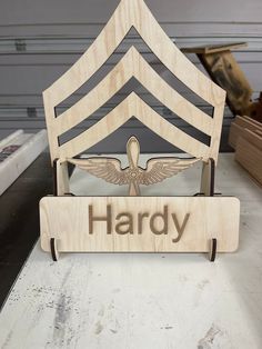 a wooden sign that says, harpy on the front and back of a boat