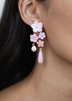 The Jeanie Earrings feature a cascade of florals, evoking the romantic charm of an Impressionist painting. Made by hand in New York, the organic variations in the pink-toned natural shell create an intriguing ombré effect, while the crystal details add sparkle. With a distinctive shape, these earrings make an undeniable statement, while remaining lightweight and comfortable to wear. Pink Christmas Clay Earrings, Dream Earrings, Jewelry Molds, Pink Statement Earrings, Beautiful Beaded Earring, Tiny Jewelry, Quilled Jewellery, Quirky Earrings, Jennifer Behr