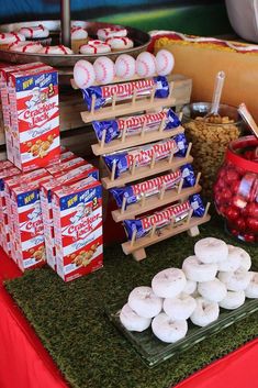 a table topped with lots of food and snacks