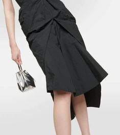 Defined by its distinctive architectural draping, the Fincher dress from Maticevski is one to make a lasting imprint. The classic black model is topped with a structured strapless bustier top and a cinched waist which glides down to an asymmetric knee-length hemline..Material: 59% polyester, 41% polyamide.Care instructions: dry clean.Made in Australia.Designer color name: Noir.Lining: 93% silk, 7% elastane.Closure: zipped back.True to size.Strapless.Internal boned corset for support.Cinched wais Black Formal Draped Skirt, Black Ruched Draped Skirt For Evening, Black Draped Skirt For Cocktail, Elegant Ruched Draped Skirt With Asymmetrical Hem, Chic Black Draped Skirt With Ruched Detail, Chic Evening Draped Skirt With Folds, Chic Black Ruched Draped Skirt, Black Asymmetrical Draped Skirt For Formal Occasions, Elegant Knee-length Draped Skirt For Spring