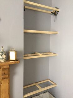 a room with some shelves and a clock on the wall