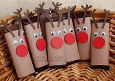 some brown paper bags with reindeer noses on them