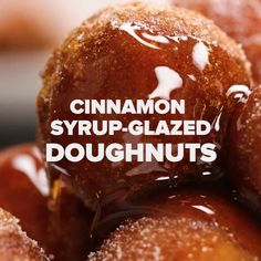 cinnamon syrup glazed doughnuts piled on top of each other with the words, cinnamon syrup glazed doughnuts