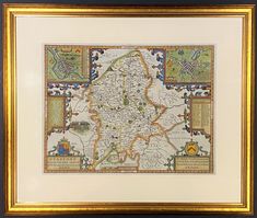 a framed map of england with all the towns and major roads in gold trimming