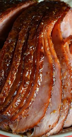 sliced ham on a red and white plate