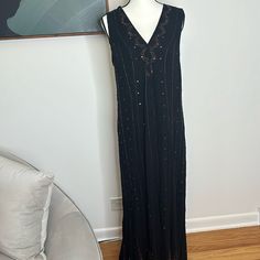 This Is A Stunning Dress From Free People Black Maxi Dress With Bronze Sequins And Beading. Functional Buttons Down The Front Of The Dress. Gauze Material Is Slightly Sheer. This Is A Size Small, But It Has Quite A Bit Of Stretch From The Crinkled Gauze Material. This Item Is Stunning And Photos Simply Do Not Do It Justice. It Is In Excellent Condition, But It Is Missing A Few Sequins And Beads. Long Boho Sequin Dress Free People, Gauze Maxi Dress, Free People Black, Black Maxi, Free People Dress, Black Maxi Dress, Stunning Dresses, Free People, The Dress