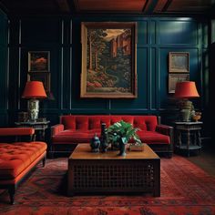 a living room with green walls and red couches