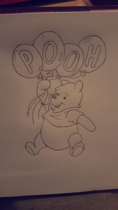 a drawing of winnie the pooh holding balloons