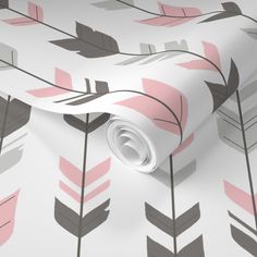 a wallpaper with pink and grey feathers on it's side, next to a white background