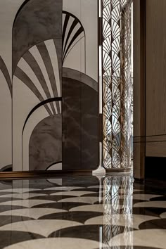 an art deco room with marble flooring and decorative wall coverings on the walls