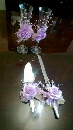 three wine glasses with purple flowers and silverware