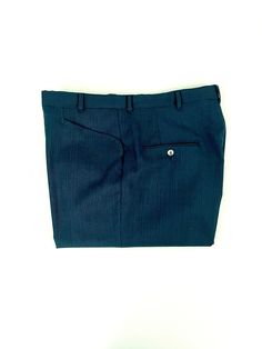 "Vintage Men's 70's Teal, Black, Wool Blend, Relaxed Fit, Cuffed Pants (W34) These 1970's Men's Pants come in a teal and black wool blend fabric with two front pockets, two back pockets and have a nylon zipper fly with a relaxed fit leg with a cuffed bottom hem. The pants are medium weight and have a slight stretch. Wool Blend No interior labels *These pants are in excellent condition. *If shipped within the US, they will ship Priority Mail for a quick delivery! Size: (34\" x 28 1/2\") Waist: 34 Blue Wool Bottoms With Welt Pockets, Tailored Blue Wool Bottoms, Tailored Wool Blue Bottoms, Fitted Blue Wool Bottoms, Fitted Wool Blue Bottoms, Vintage Wool Pants For Formal Occasions, Fitted Wool Pants With Pockets, Retro Fitted Wool Bottoms, Fitted Vintage Wool Pants