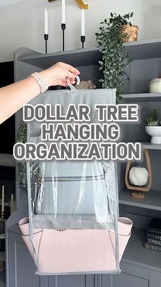 the dollar tree hanging organization system is organized with clear plastic bags and pink leather handles