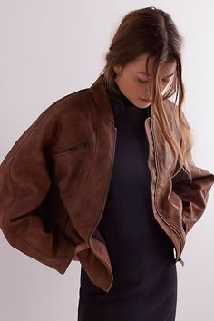 This vegan leather bomber from We The Free features extra wide, drop-shoulder sleeves for a subtly statement silhouette. **Fit:** Relaxed, hip length **Features:** Vegan leather fabrication, bomber style, banded collar, zipper pockets at chest and sides, zipper closure, wide drop-shoulder sleeves **Why We | We The Free Vinny Vegan Bomber Jacket at Free People in Brown, Size: L Women Leather Jacket Style, Brown Leather Jacket Aesthetic, Short Leather Trench, Leather Jacket Aesthetic, Pnw Style, Trendy Leather Jacket, Womens Leather Jacket, Nyc Fits, Winter Leather Jackets