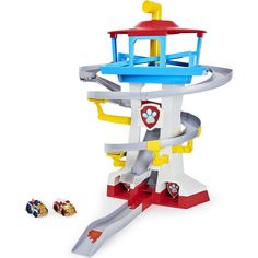 a toy playset with cars and a lighthouse