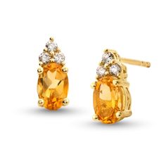 Make their November birthday a magical one with these stunning citrine and diamond stud earrings. 10K gold Each earring features a 6.0 x 4 oval-shaped golden-yellow citrine center stone Trios of diamonds top each center stone 1/10 ct. t.w. of diamonds Post earrings; friction backs Yellow Gold Gemstone Diamond Earrings Gift, 14k Yellow Gold Diamond Gemstone Earrings, Yellow Gold Diamond Gemstone Earrings In 14k, 14k Yellow Gold Diamond Earrings With Gemstone, Oval Yellow Gold Earrings With Diamond Accents, Yellow Gold Oval Diamond Earrings With Gemstone, Oval Yellow Gold Diamond Earrings For Anniversary, Gold Oval Diamond Earrings For Gift, Yellow Gold Oval Earrings With Birthstone