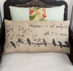 a pillow that has birds on it and the words happiness is not fragile, but it's sweet