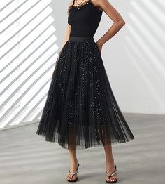 Look your best in the Prestigious Tulle Pleated Flowy Maxi Skirt. This lightweight and comfortable skirt is crafted from soft tulle that is pleated for maximum comfort. Its flowy skirt design adds a touch of class and elegance to your wardrobe. Perfect for formal occasions or everyday wear. 100% Polyester Imported Elegant pleated design: This pleated skirt features a beautiful pleated design that creates a flowing, elegant silhouette. The pleats are evenly spaced and give the skirt a luxurious t Pleated Tulle Skirt, Flowy Maxi Skirt, Pleated Tulle, Comfortable Skirts, Flowy Maxi Skirts, Winter Knit Hats, Soft Tulle, Black Sparkle, Flowy Skirt