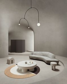 a living room filled with white furniture and hanging lights above the couch, coffee table and stools