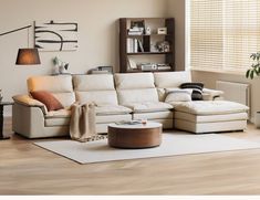 a living room with white furniture and wooden floors