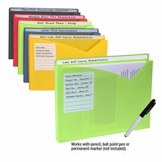 an assortment of folders with writing on them and a pen next to each file