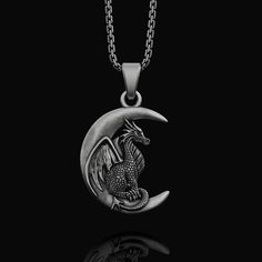 "Silver Moon Dragon Necklace, Fantasy Jewelry, Crescent Charm, Mythical Creature, Dragon Jewelry, Unisex Pendant Birthday, Memorial Gift ✦ Jewelry Details ✦ * Material: 925 Sterling Silver * Pendant's Dimensions: 32x27mm * Weight: 15-16grams * Finish: Oxidized, Polished, Gold, Rose Gold * Stamp: 925 * Bail: 4mm * Ideal for daily use with an oxidized finish on 925 sterling silver, which makes details more attractive and eye-catching! * It can be made in 10K - 14K - 18K white/rose/yellow gold as w Mythical Jewelry, Elegant Dragon Design Necklace As A Gift, Dragon Jewelry Necklace, Moon Dragon, Silver Dragon Jewelry, Gold Fantasy Necklace With Dragon Design, Cute Dragon Necklace, Dragon Pendant Necklaces, Black Dragon Necklace