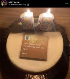 a birthday cake with two candles on it